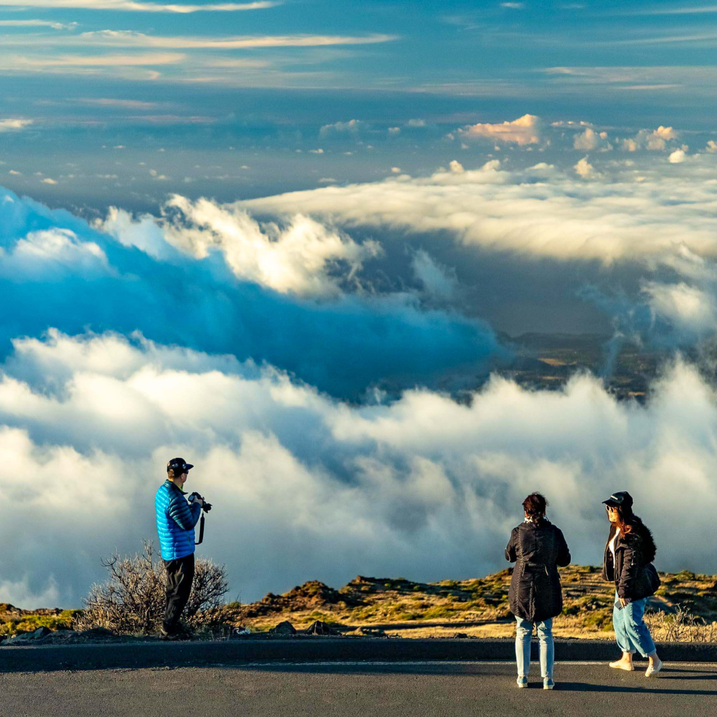 haleakala sunset clouds and visitors at overlook maui