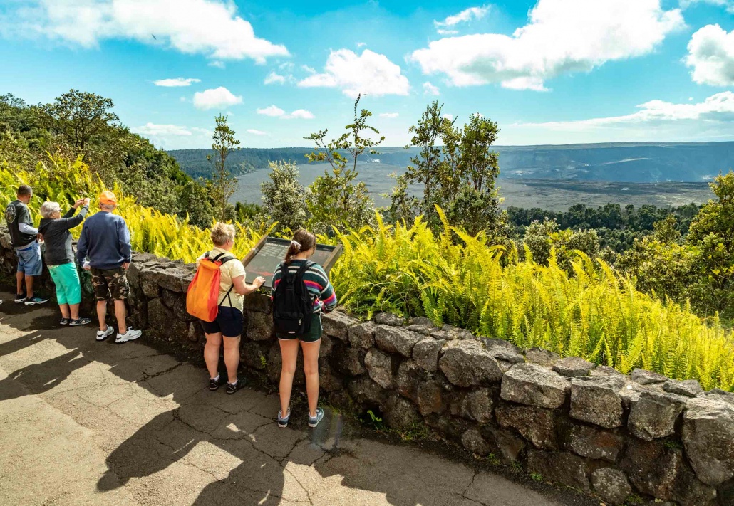 Visitors at overlook of Kilauea Caldera in Volcanoes National Park Big Island Hawaii