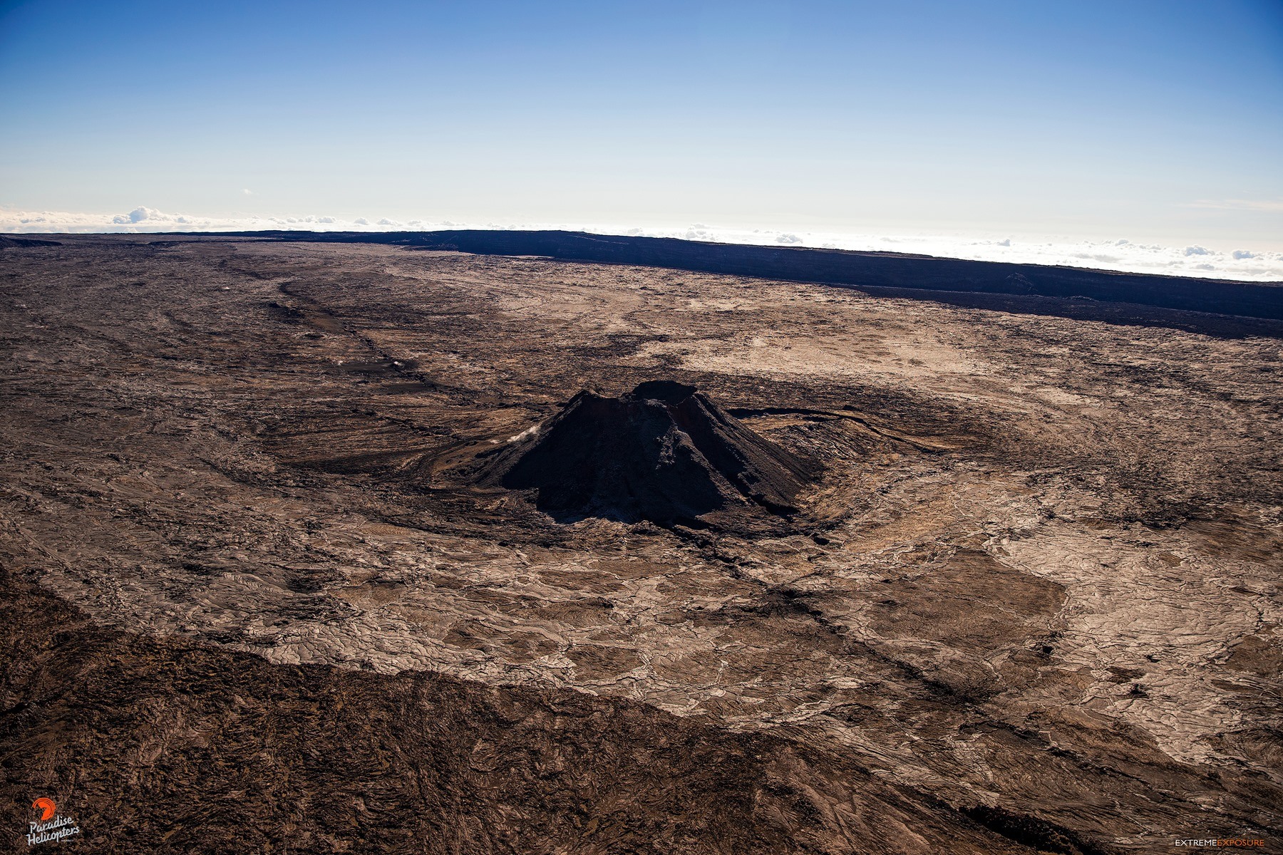 a large vent on the floor of mokuaweoweo caldera mauna loa overflight paradise helicopters big island july